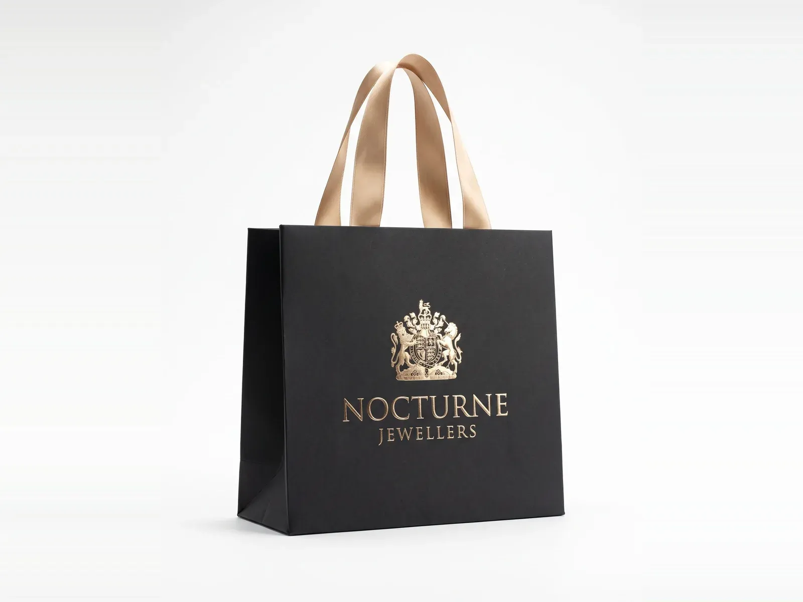 Black shopping bag with a gold foil crest
